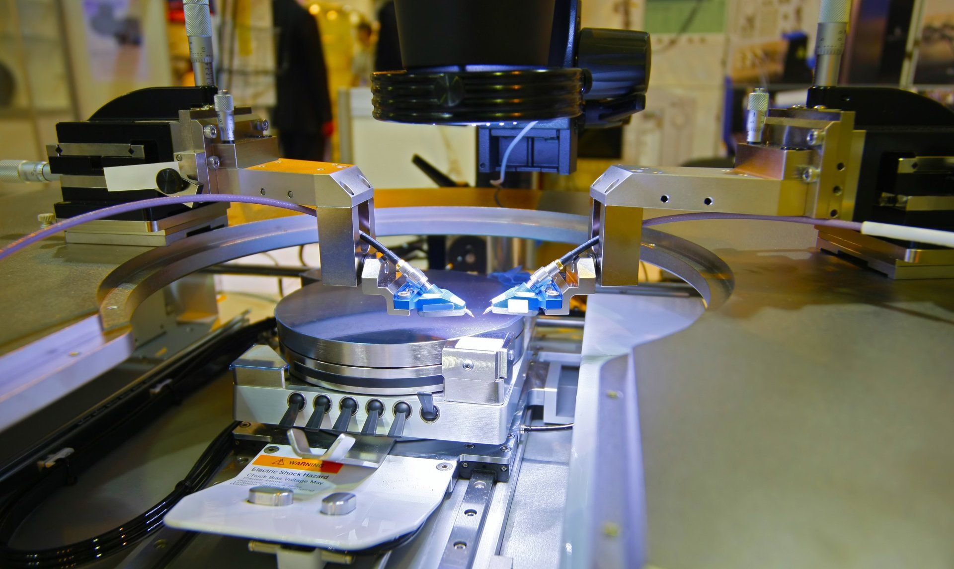 A machine is working on a piece of metal in a factory.