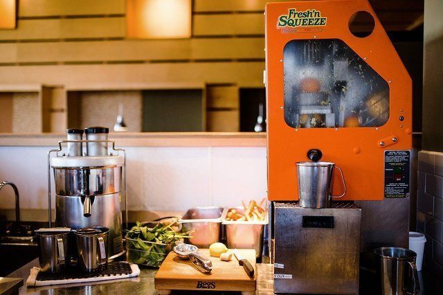a kitchen with a machine that says fresh 'n sarma on it