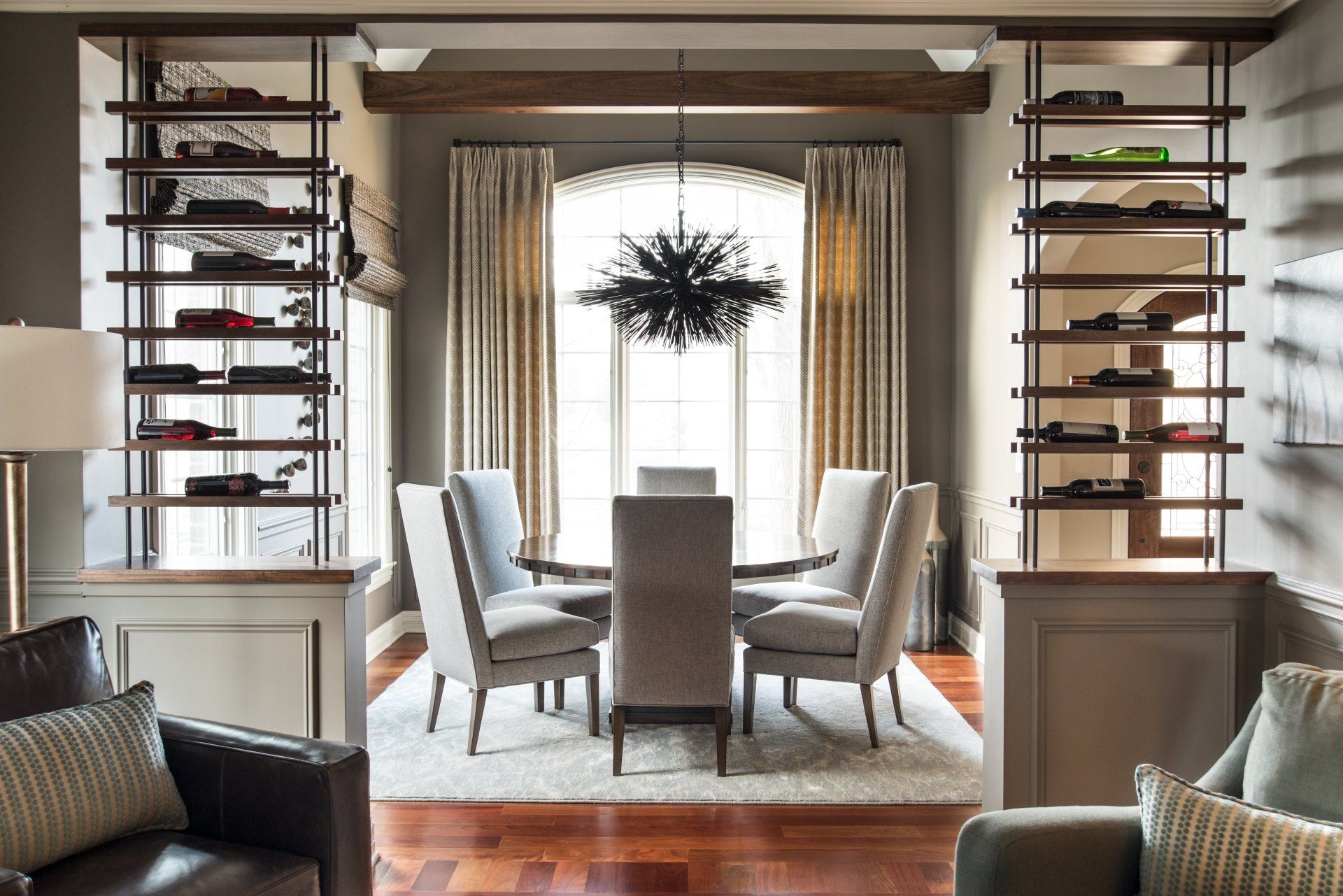 A living room with a dining room table and chairs
