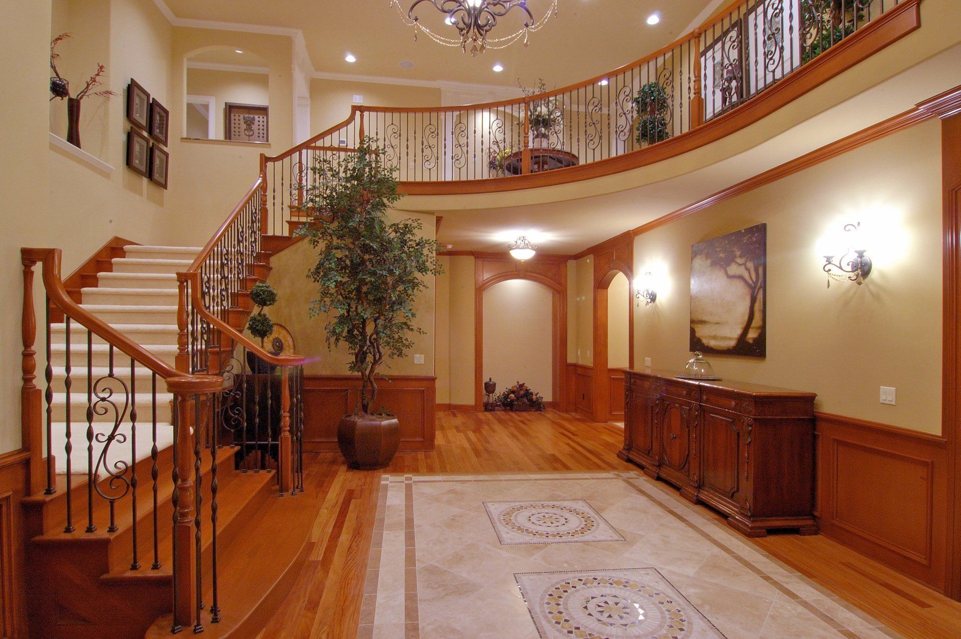 a large hallway with stairs leading up to the second floor