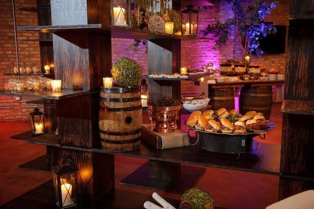 A wooden shelf filled with lots of food and candles.