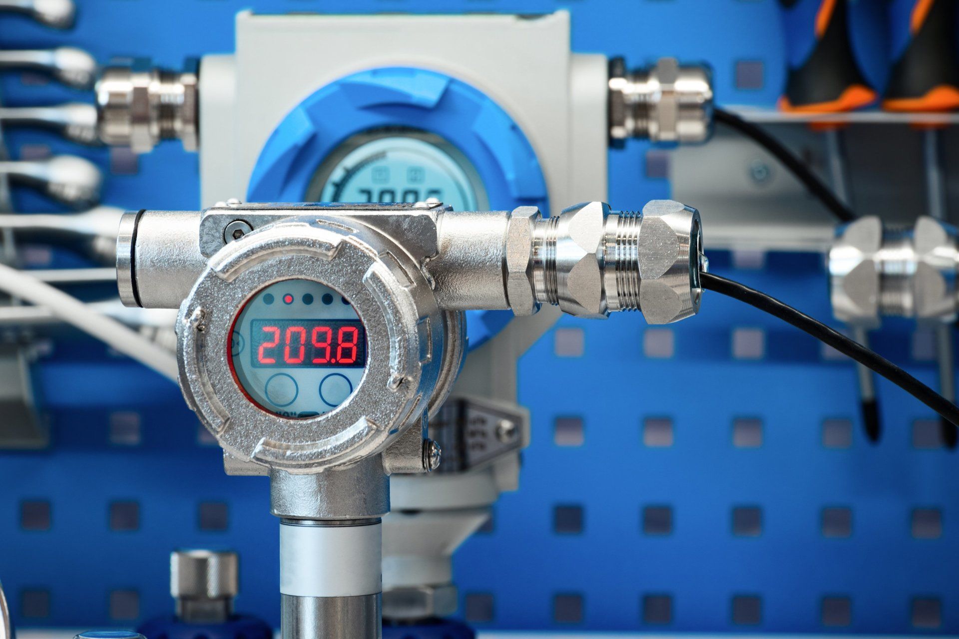 a close up of a gas pressure gauge with a digital display .