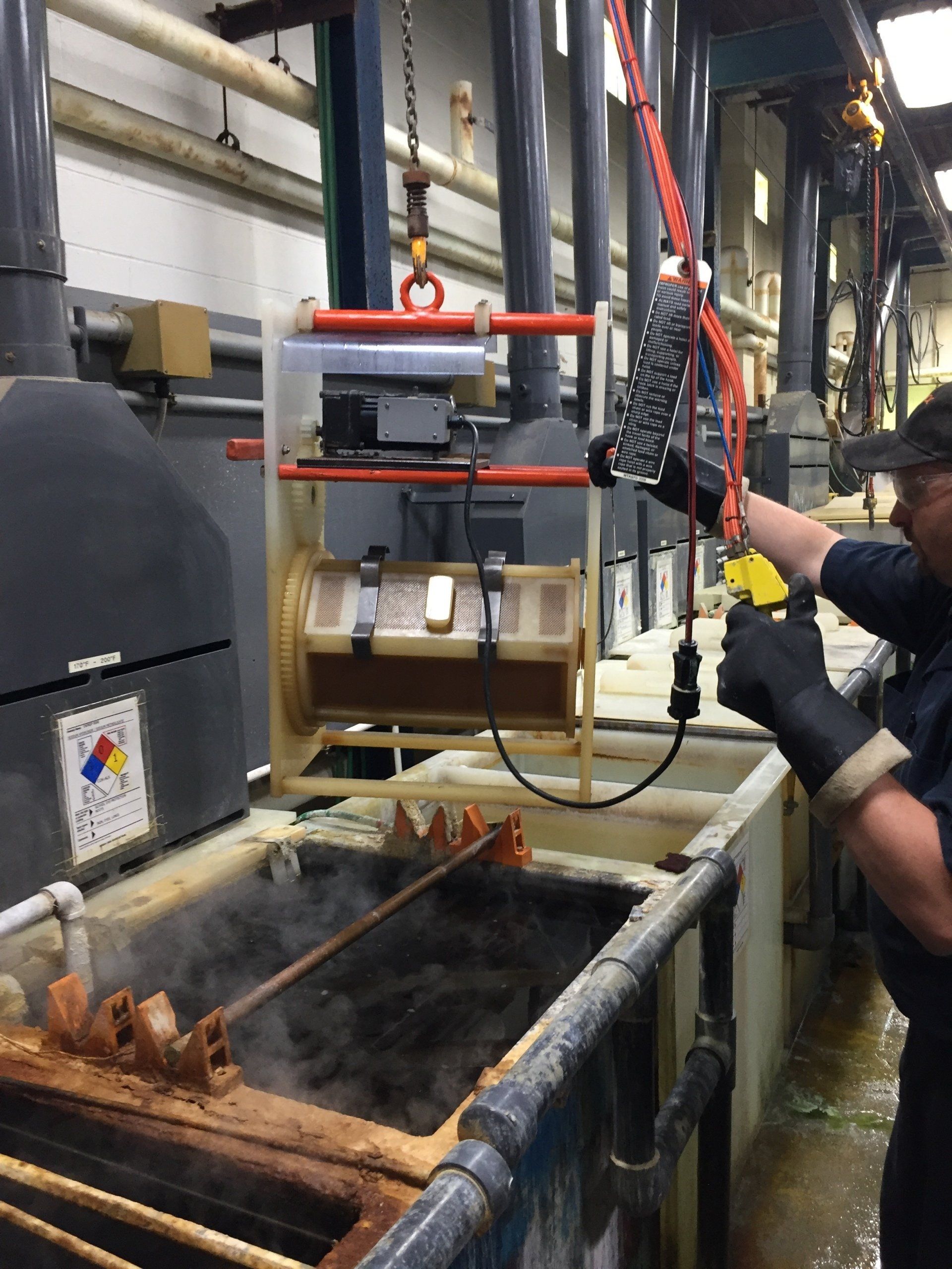 A man is working on a machine in a factory