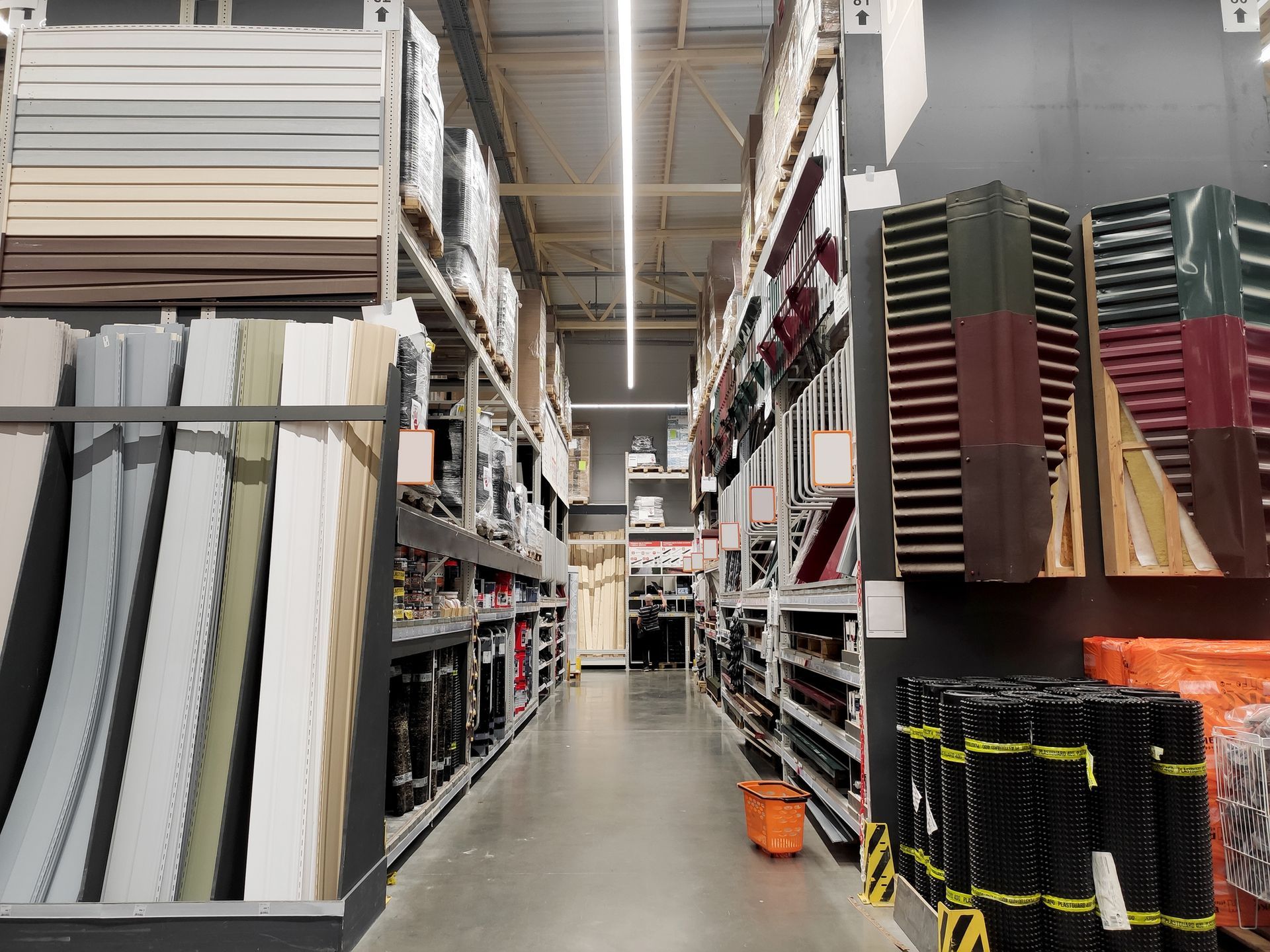 Aisle in a hardware store with building materials and supplies. 