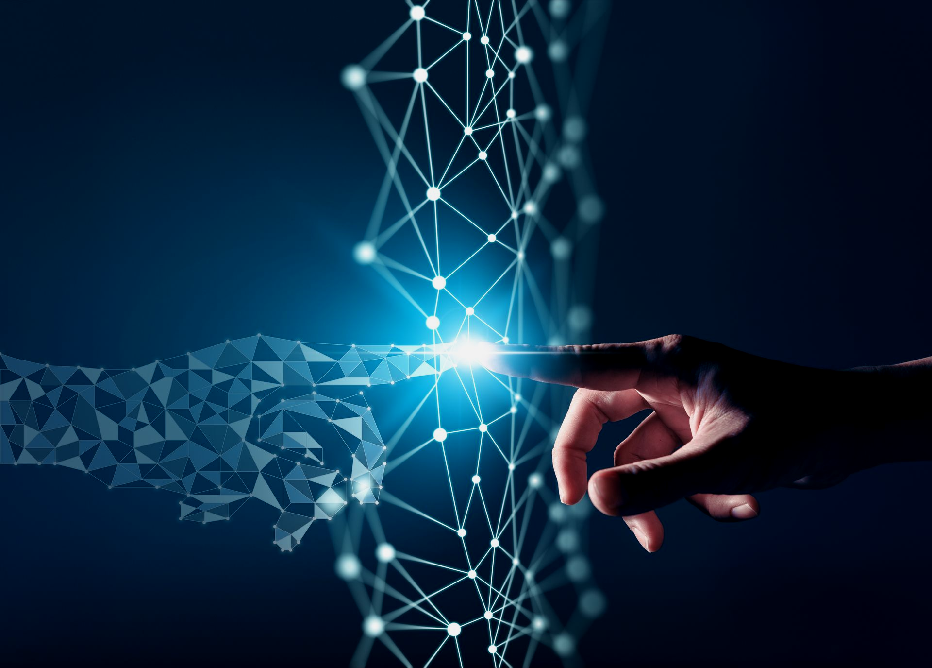 Hand touching a glowing digital network, symbolizing connection and technology.