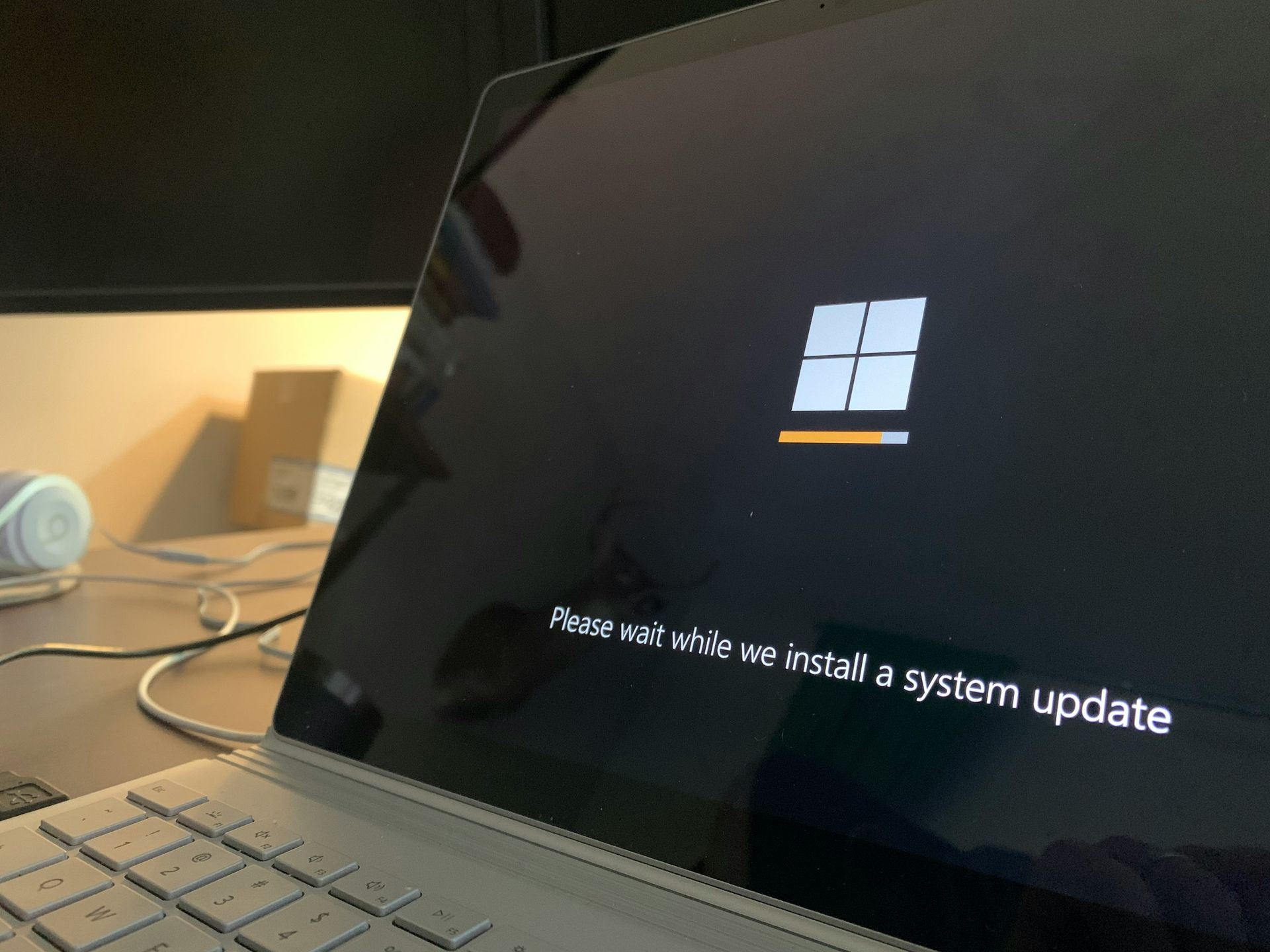 Laptop screen displaying Windows logo and 