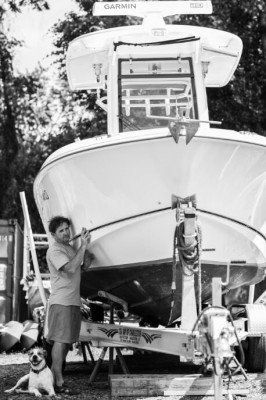 A Man Standing Beside a Boat — Bluffton, SC — Custom Marine Finishes