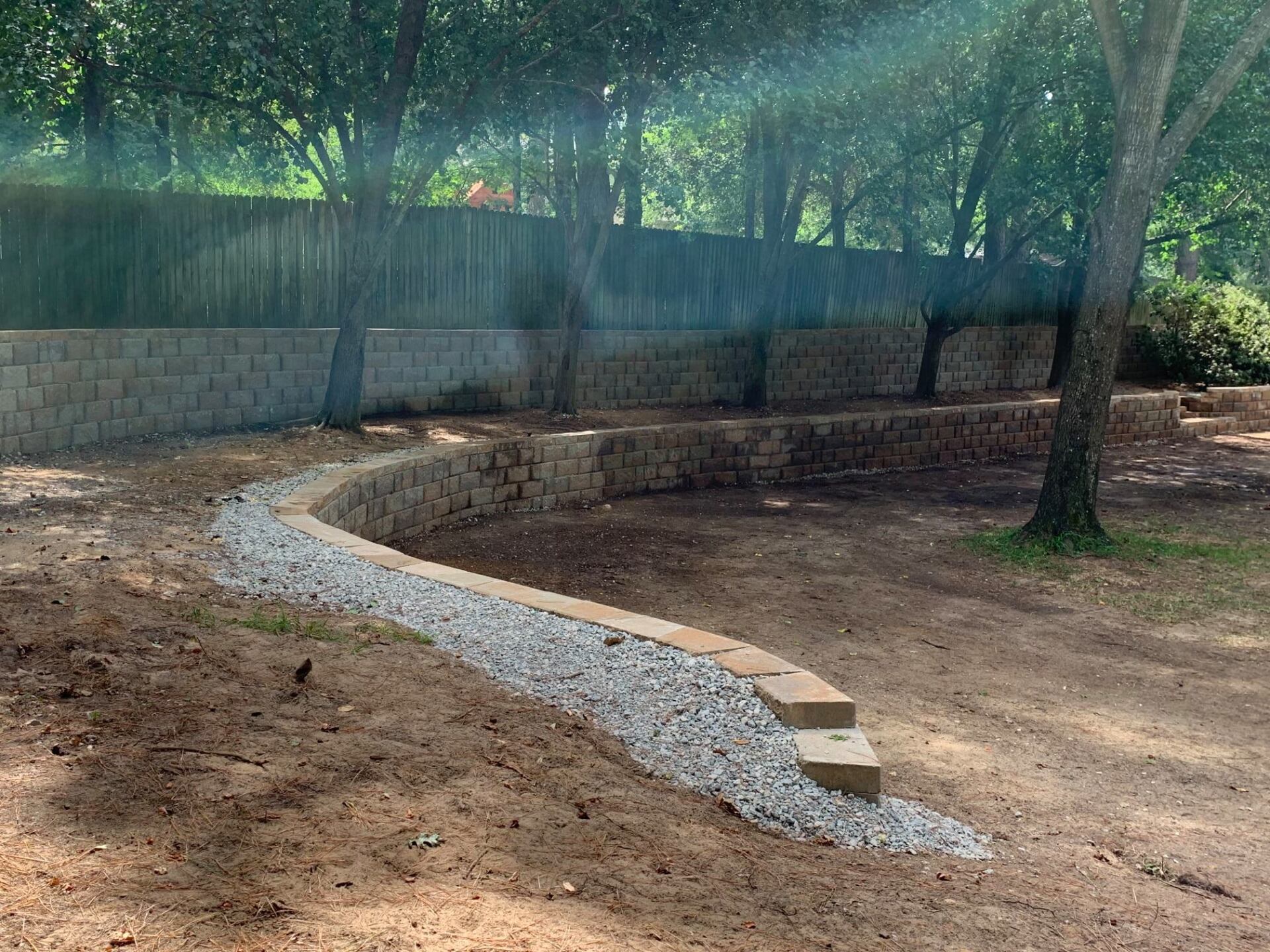 Trees Near Retaining Wall — Tyler, TX — Creative Landscape Solutions