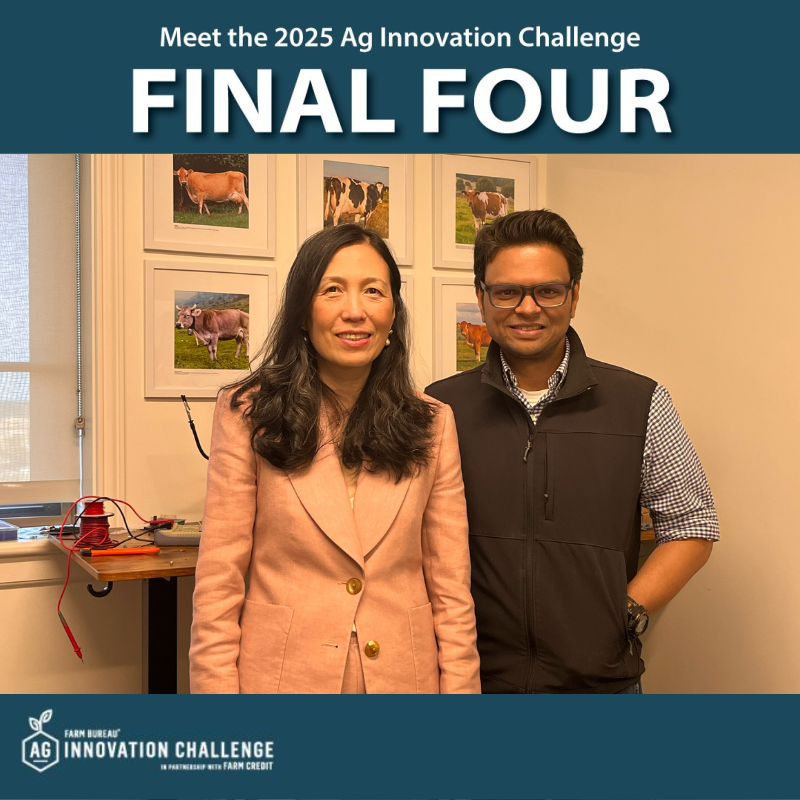 A man and a woman are standing next to each other in front of a poster that says final four