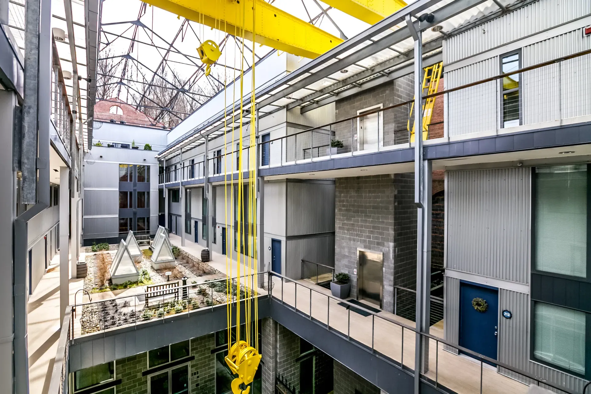 a large building with a yellow crane hanging from the ceiling .