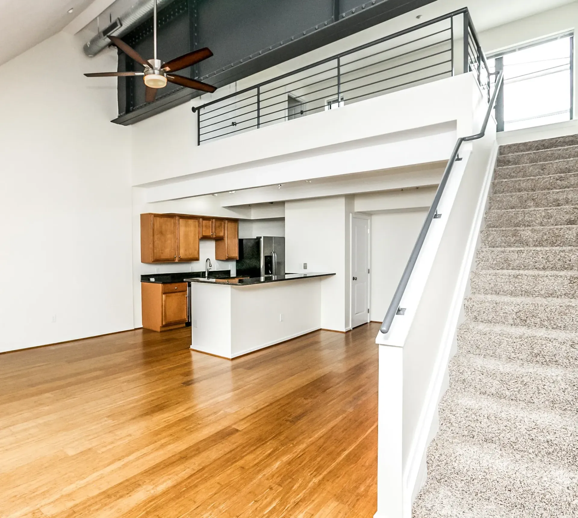 there is a staircase leading up to the second floor of a house .