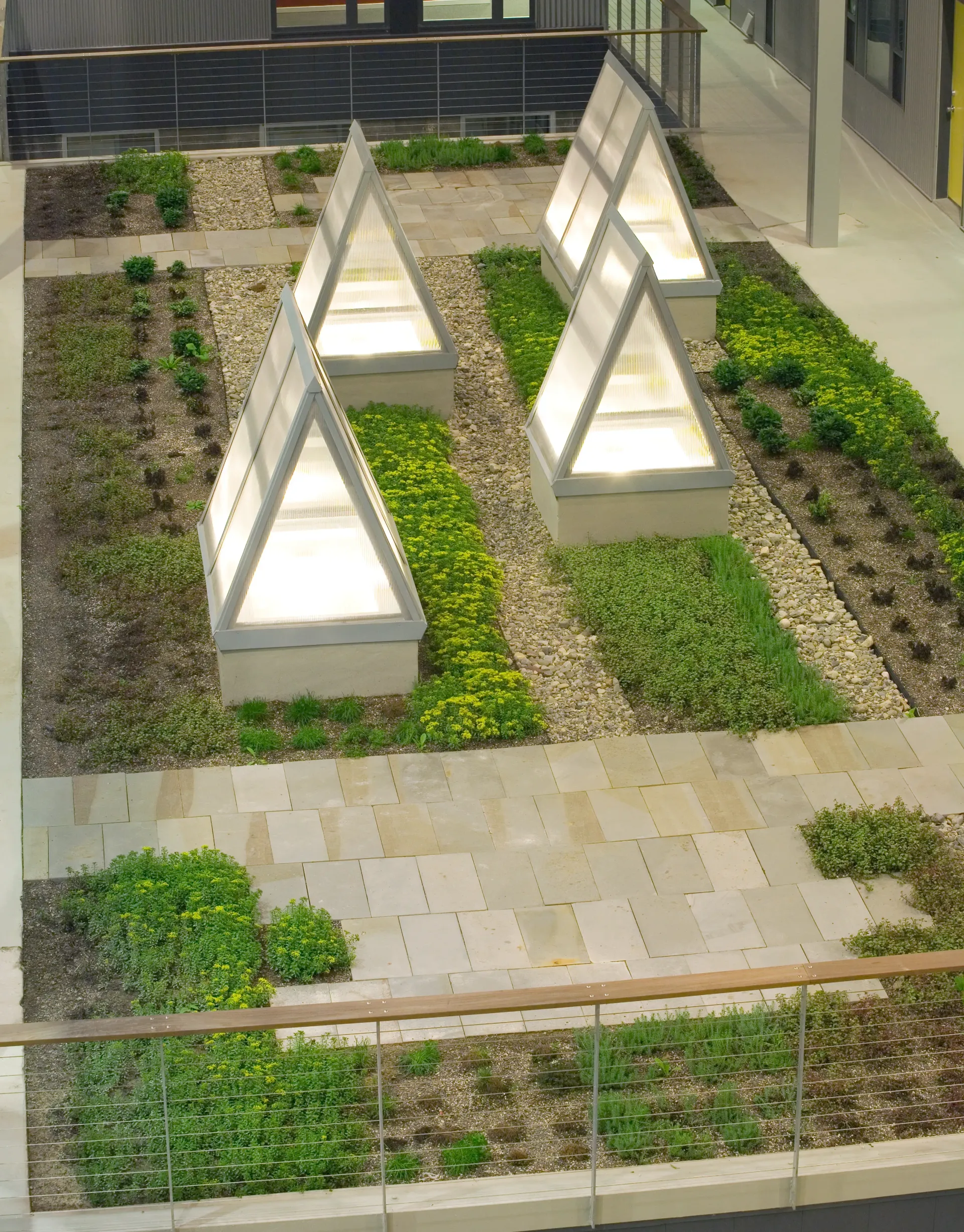 an aerial view of a garden with triangle shaped planters