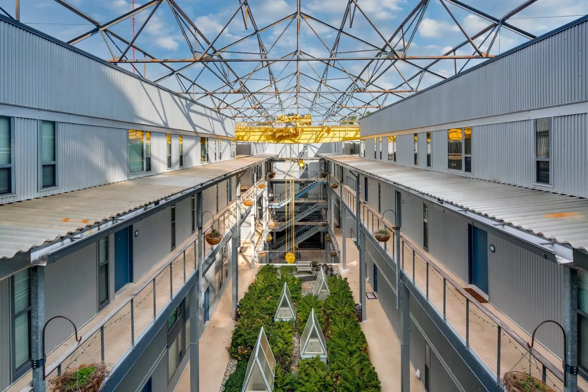 an aerial view of a large building with lots of windows and balconies .