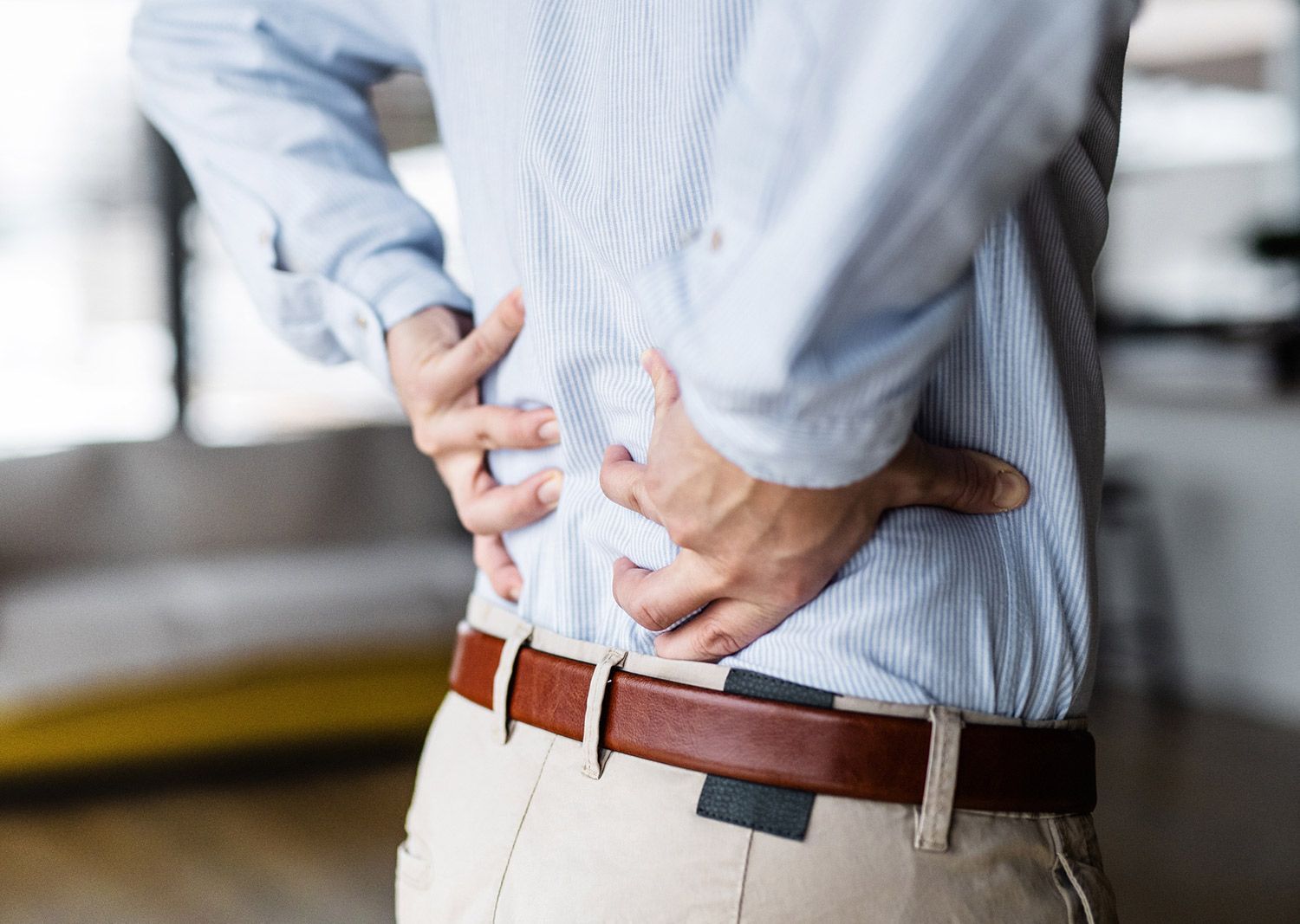 Man Feeling the Back Pain — Saint Petersburg, FL — Miller Chiropractic & Wellness