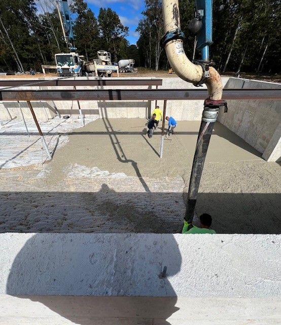 A hose is attached to a pipe in a construction site