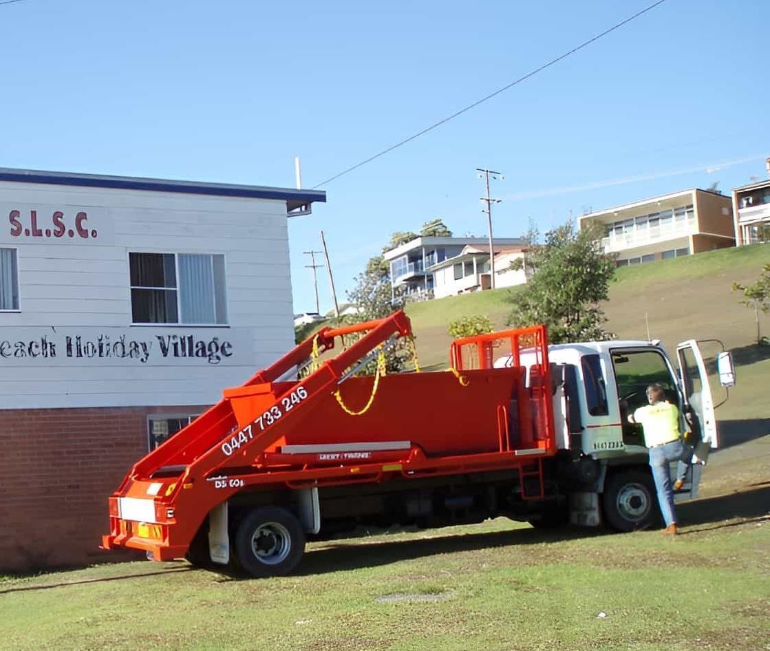 A Truck Is Parked In Front Of A Building That Says Wauchope-Bonny Hills — Red E Bins In Lake Cathie, NSW