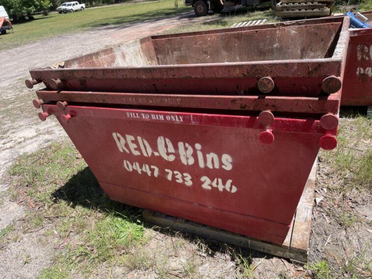 A red skip bin that says red e bins on it  — Red E Bins In Lake Cathie, NSW
