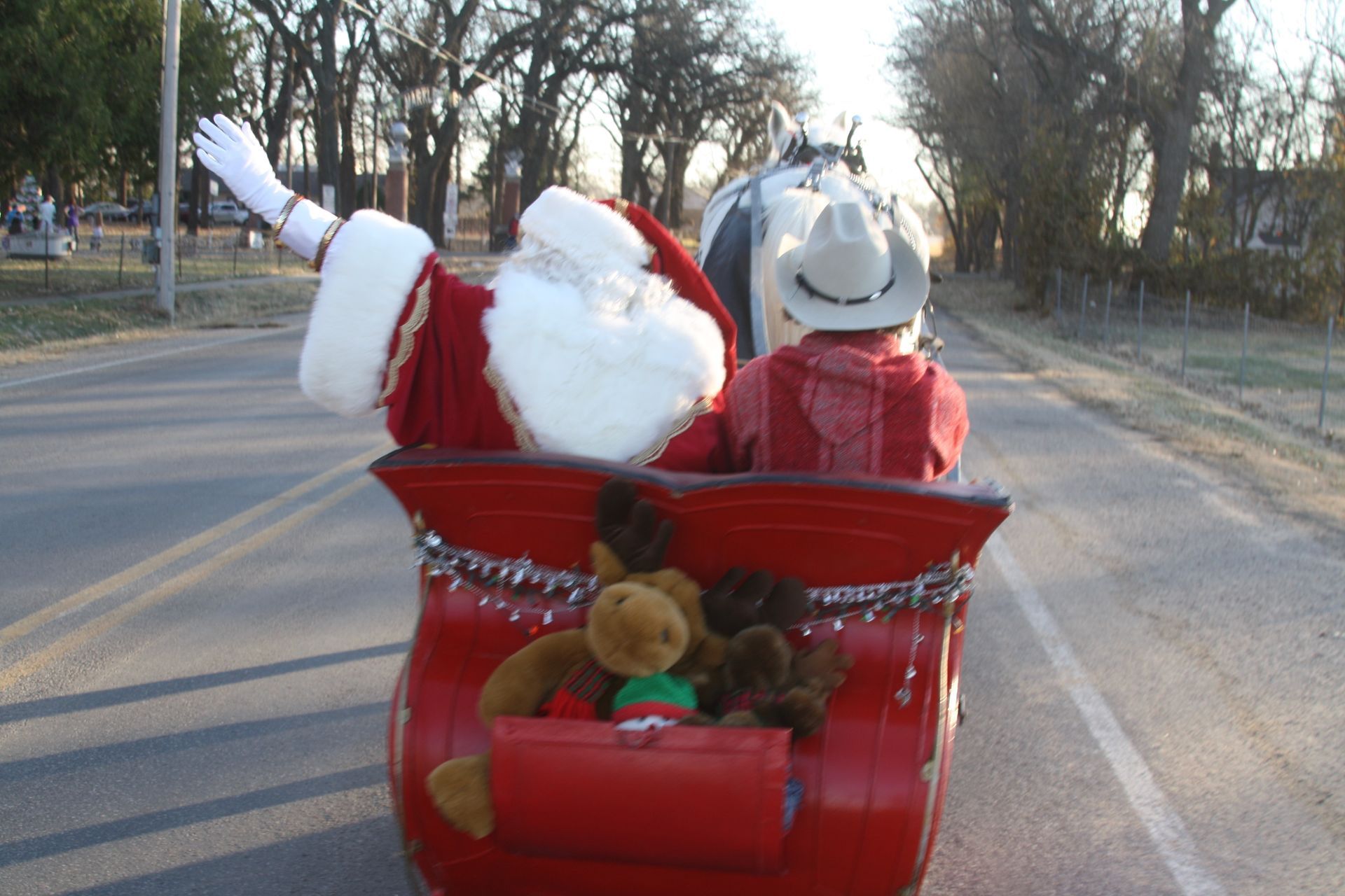 western santa in horse drawn sleigh