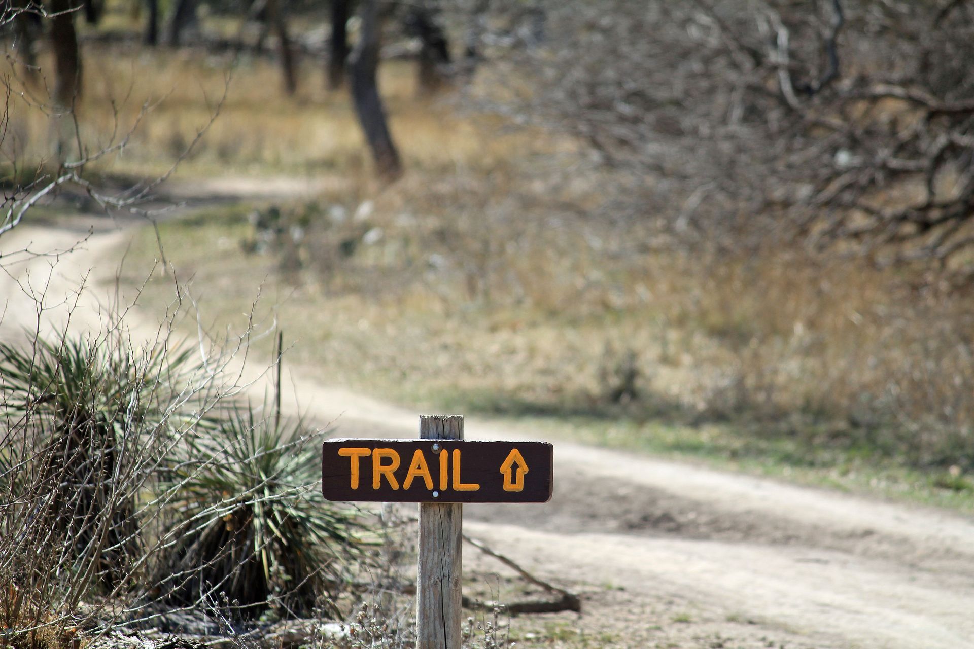 trail sign on path in Texas