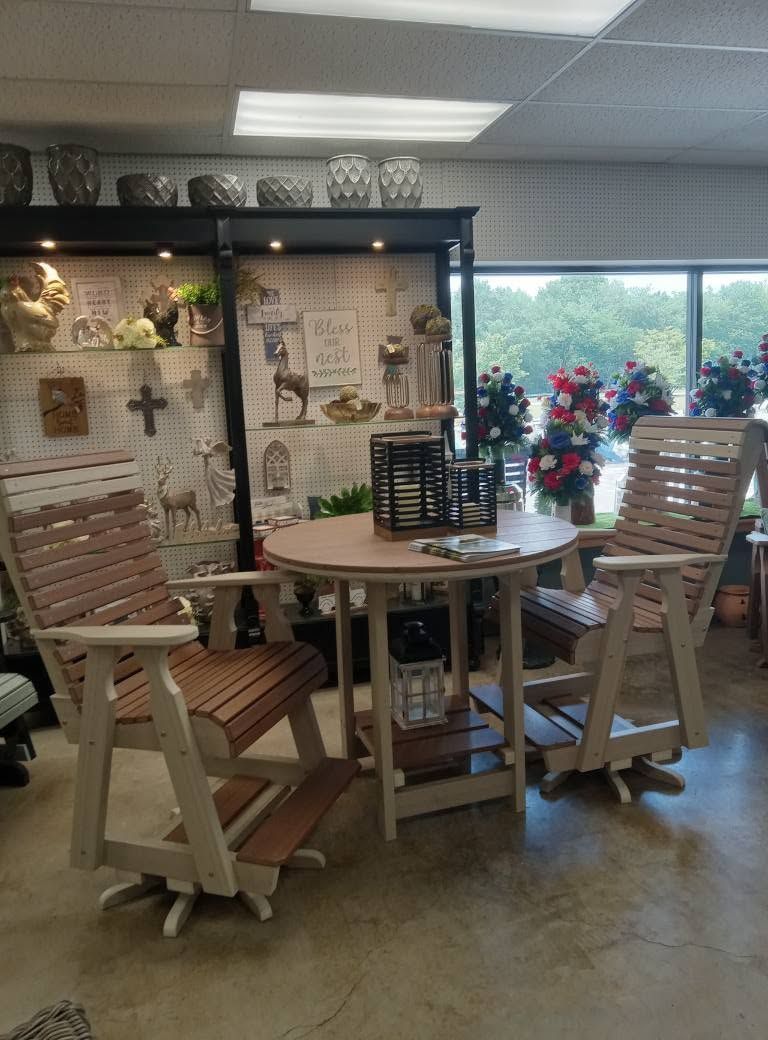 A room with a table and chairs in it and a window.