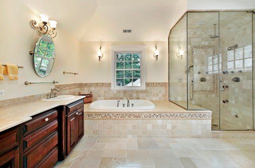 bathroom remodeling complete soaking tub and shower with dark wood vanity
