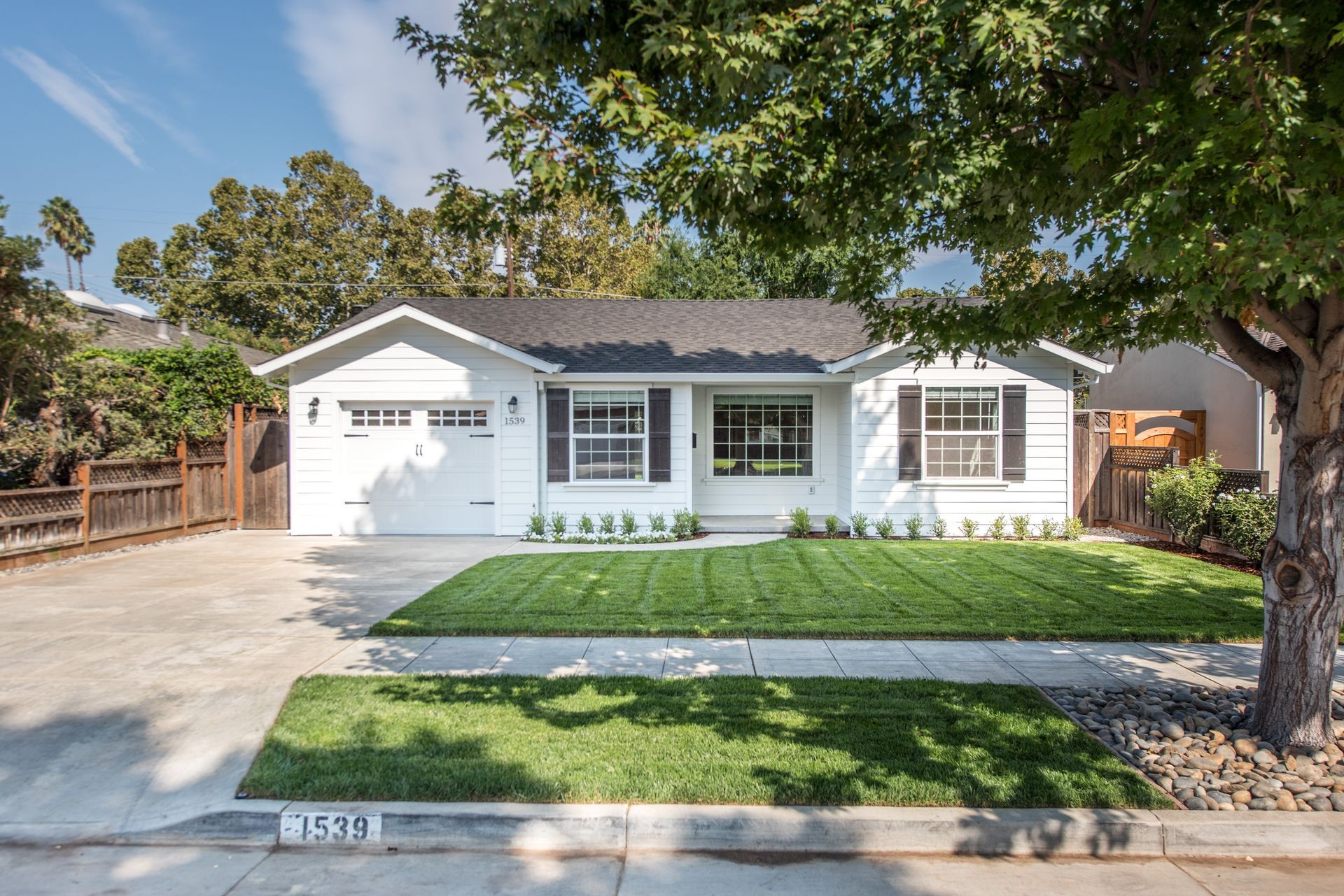 A conference room with a table and chairs and a yellow light hanging from the ceiling.