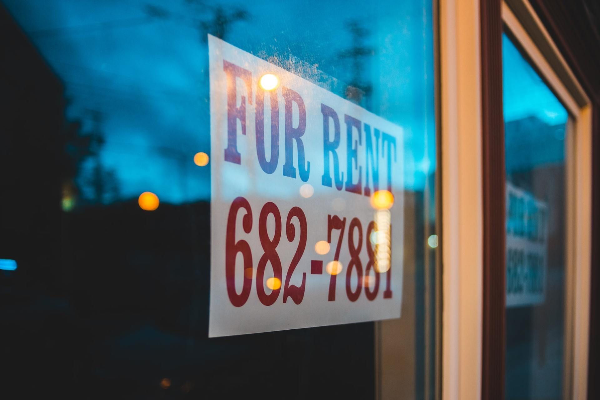 A for rent sign is displayed in a window.