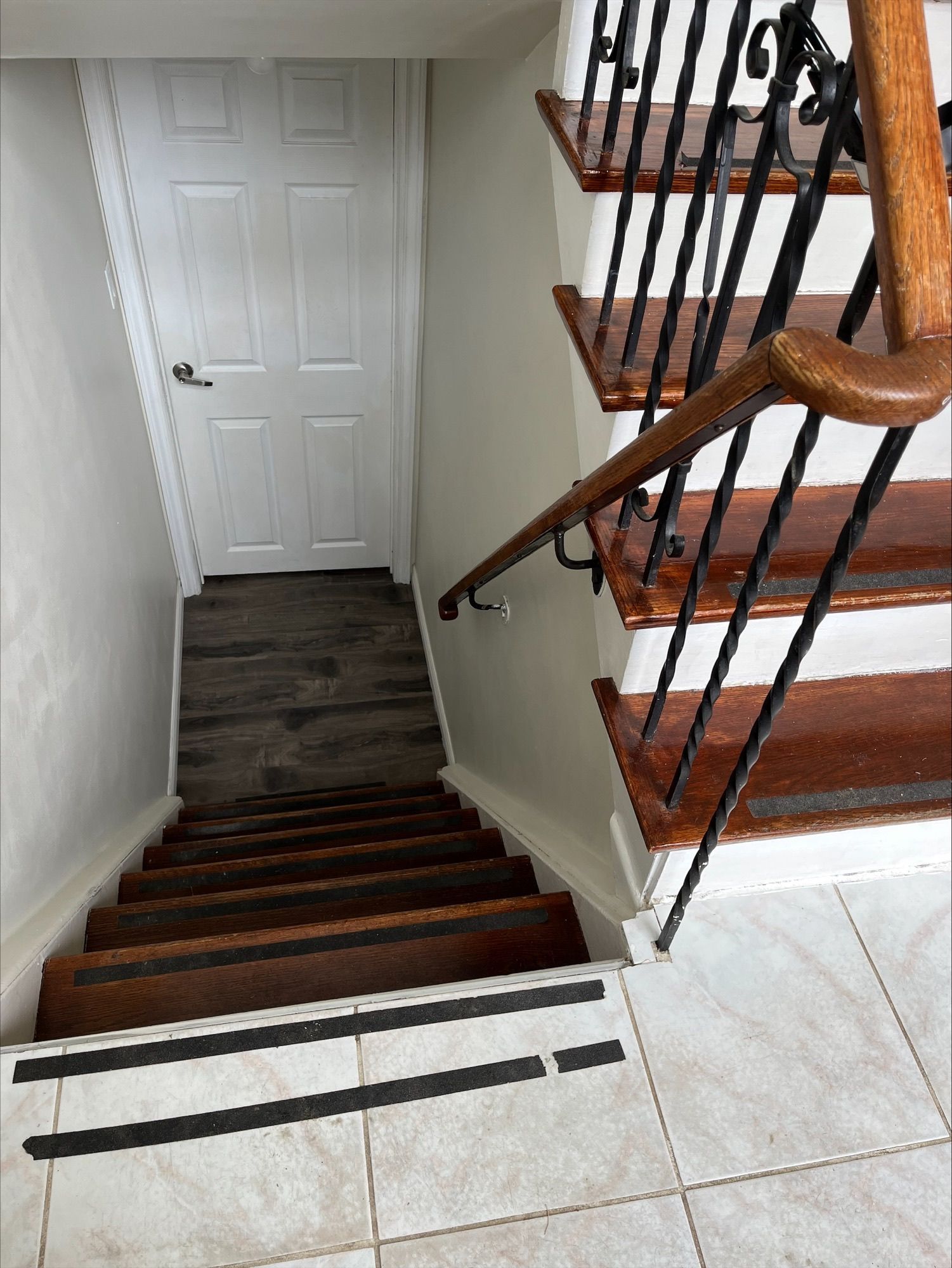 95 Heslop Road Lower | Milton, Ontario wooden staircase with a wrought iron railing