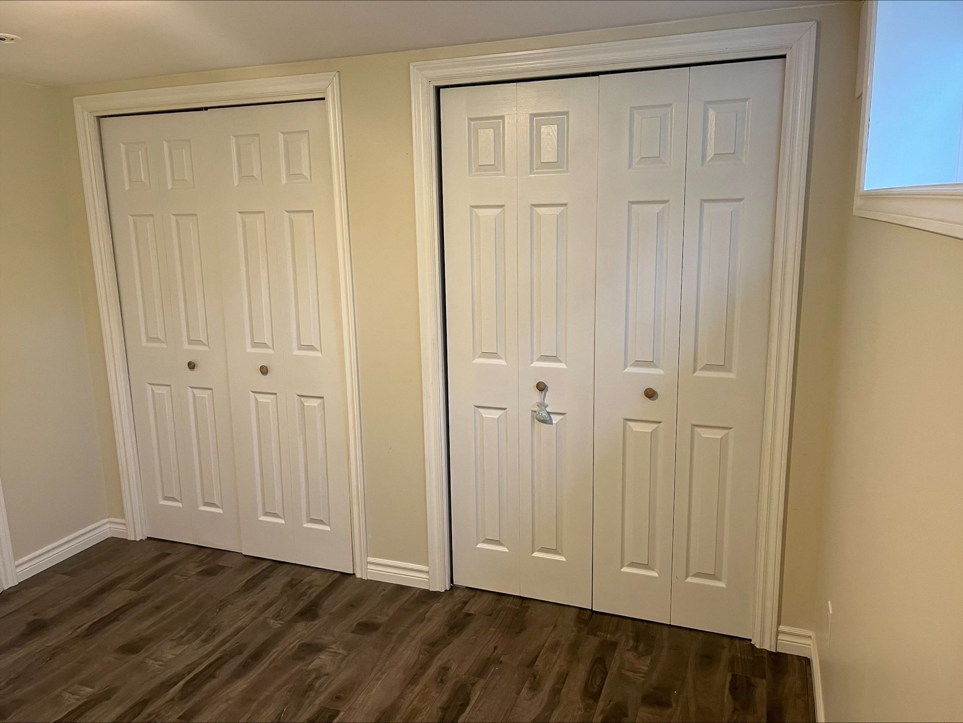 95 Heslop Road Lower | Milton, Ontario closet with white doors and wood floors