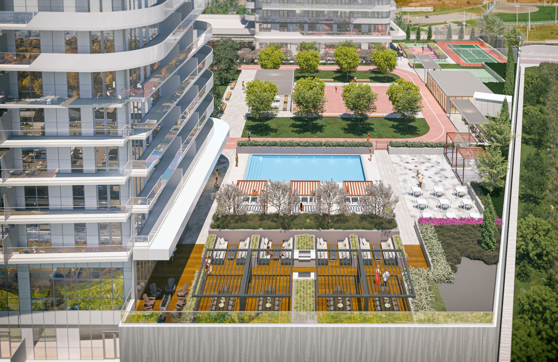Aerial view of a building's rooftop with a pool, patio, and green space for recreation.