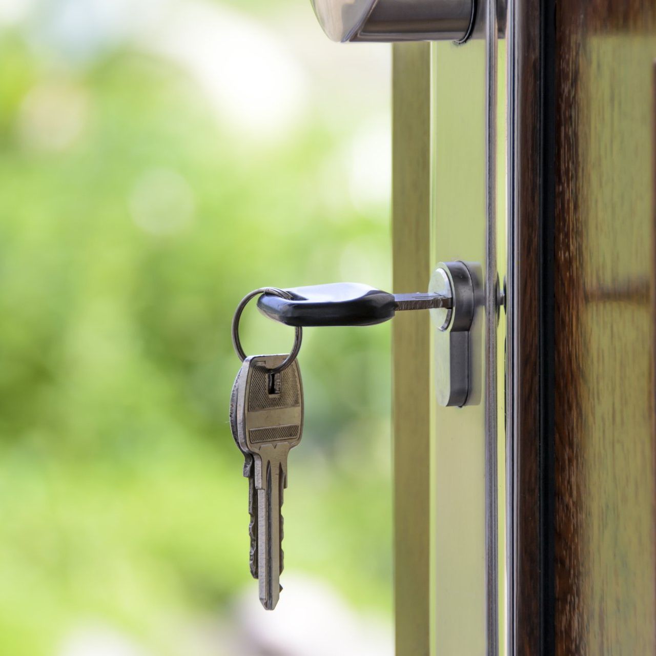 A close up of a key in a door lock.