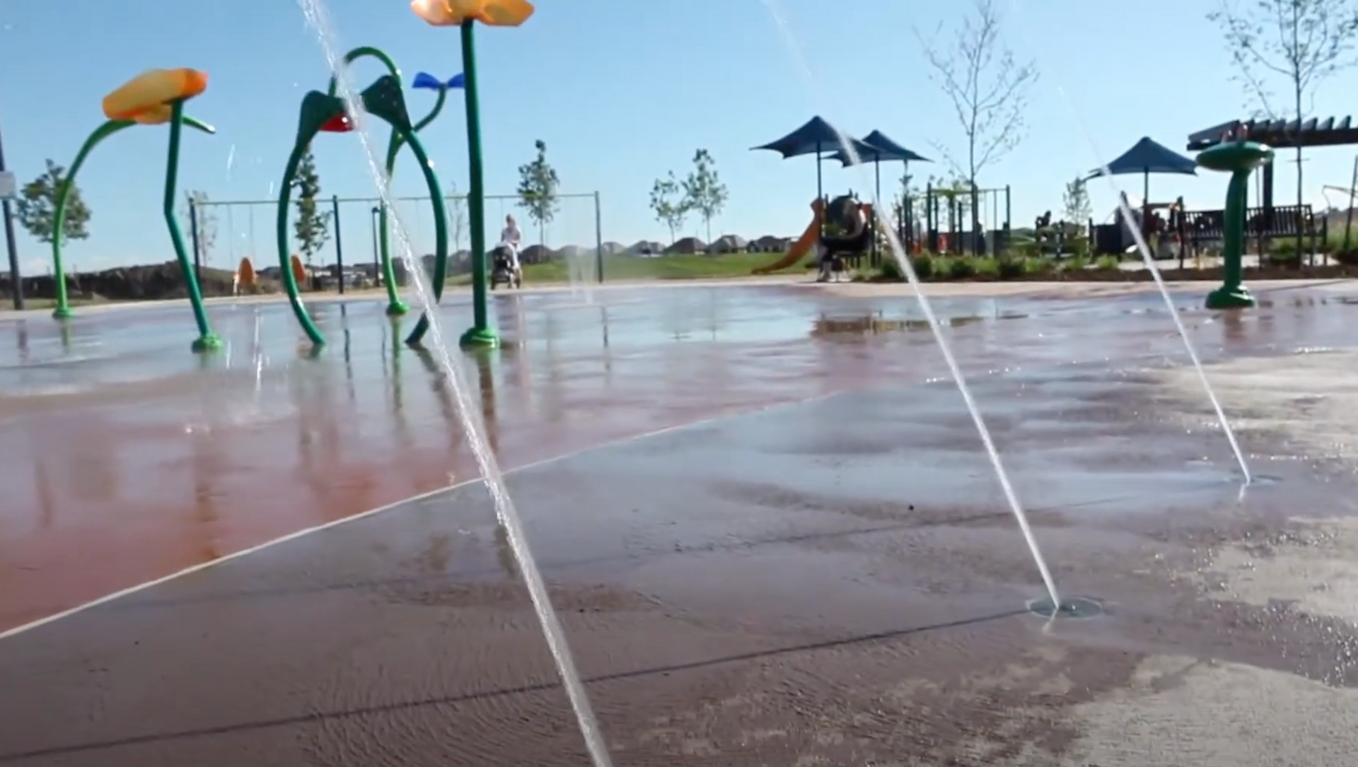 A water park with a lot of sprinklers in it