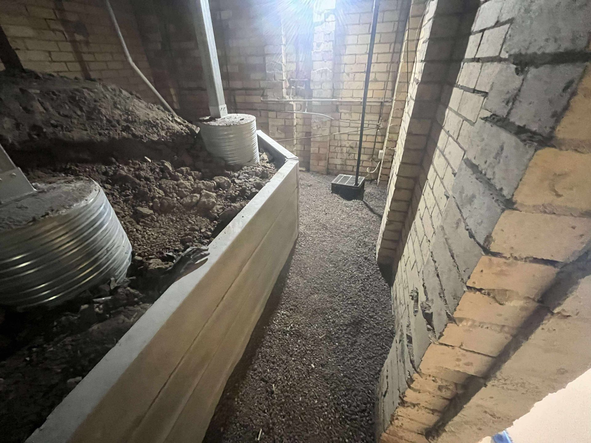 Steel Piers Under Newcastle Home and Retaining Wall in basement
