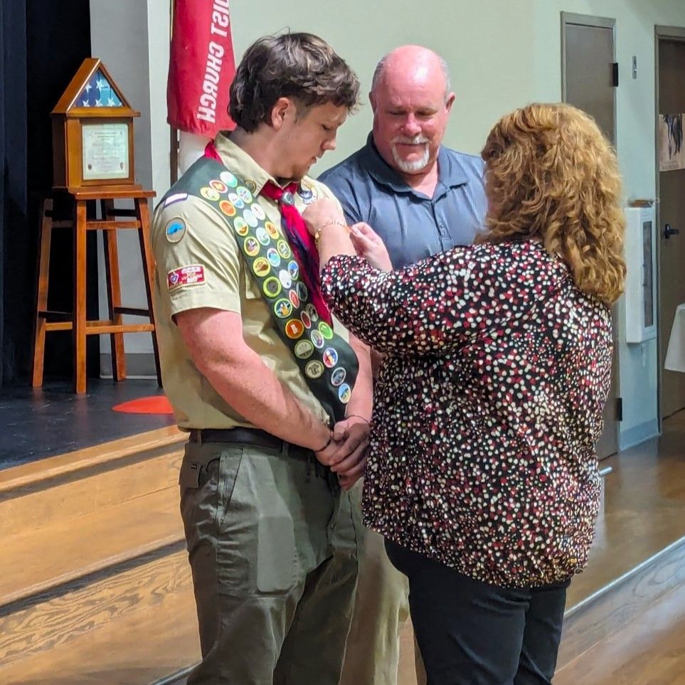 Cooper being pinned with his Eagle Scout award