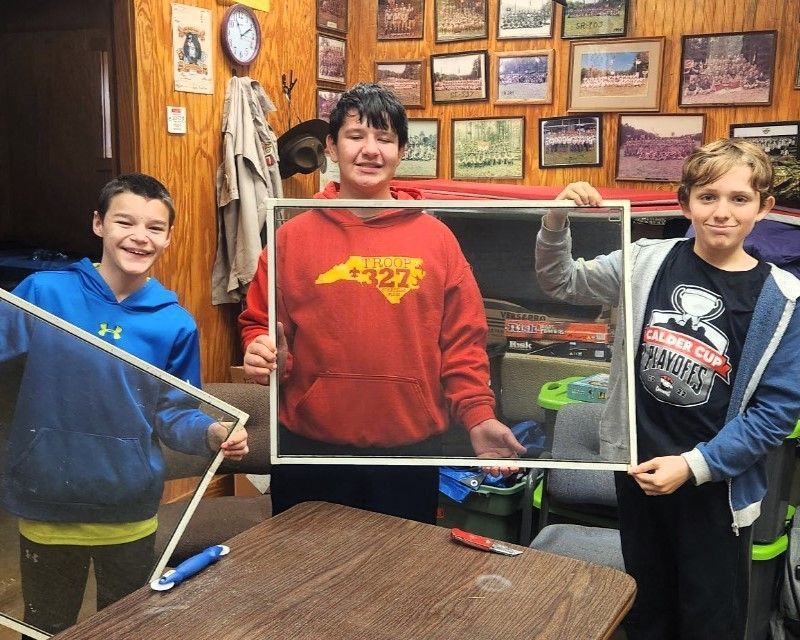 A boy in a red hoodie with the number 43223 on it