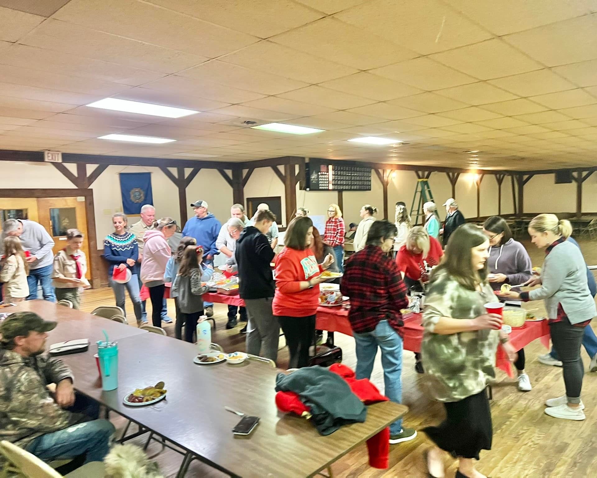 A boy scout logo with an eagle and shield on a white background.