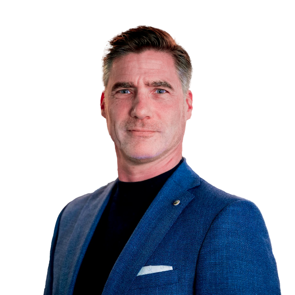 Man in blue blazer and black shirt, looking forward with a neutral expression.