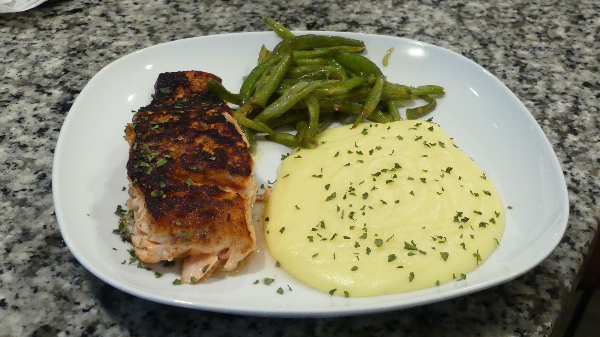 Flirty private chef from A Woman’s Touch presenting upscale cuisine