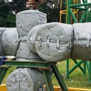 A bunch of bags sitting on top of each other on a table.