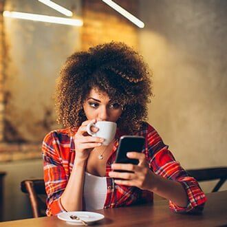 Woman Using Mobile Phone — Health Insurance in Bozeman, MT Woman Using Mobile Phone — Health Insurance in Bozeman, MT