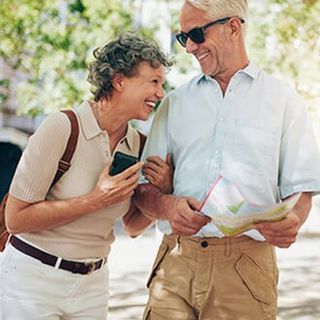 Retired Couple Walking Around the Town — Medicare Plans in Bozeman, MT