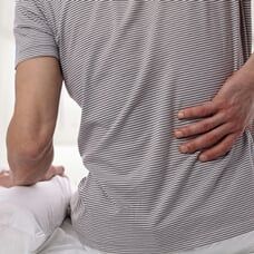 Man Suffering from Back Pain — Long Term Care Insurance in Bozeman, MT