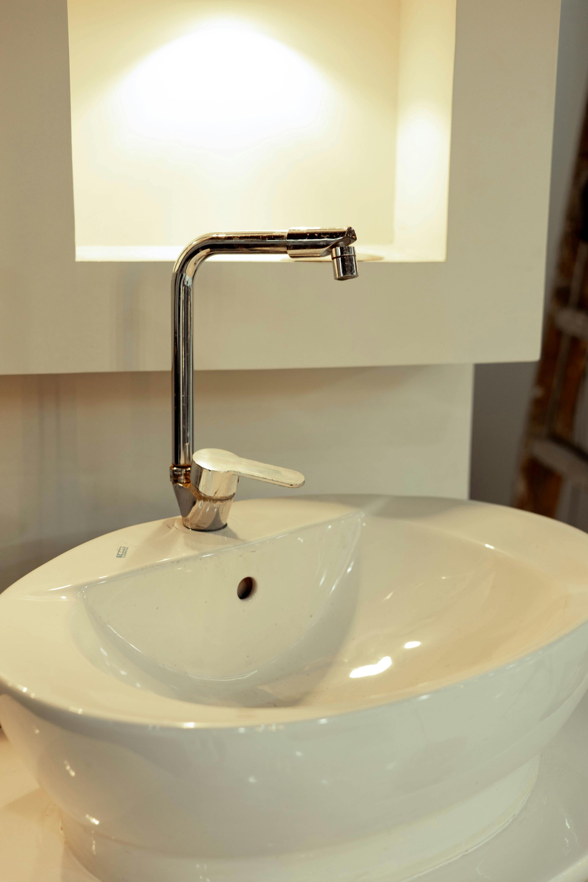 White Ceramic Sink With Chrome Faucet — DSR Plumbing Pty Ltd in Cessnock, NSW