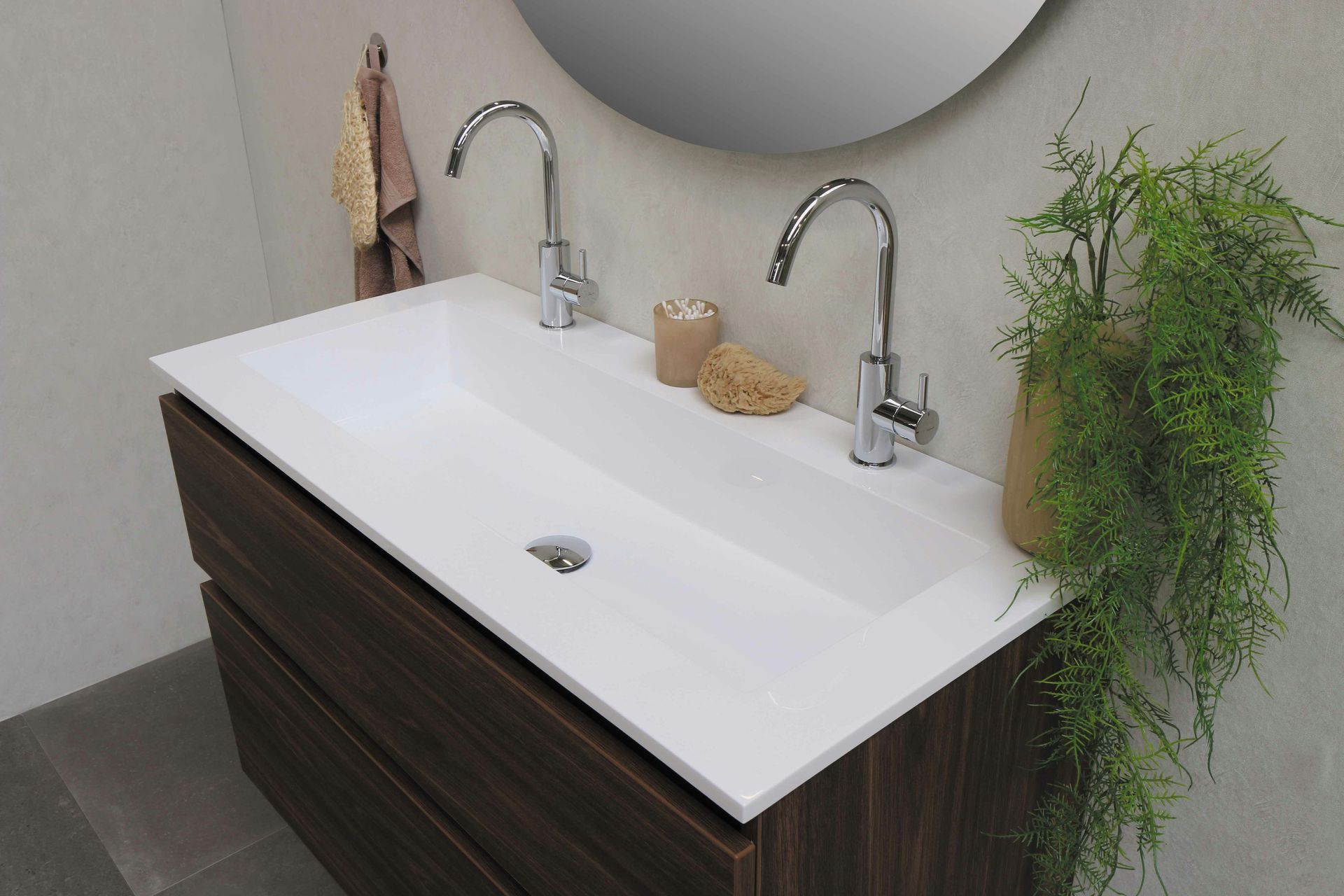 Bathroom Vanity With Two Faucets And A Round Mirror — DSR Plumbing Pty Ltd in Thornton, NSW