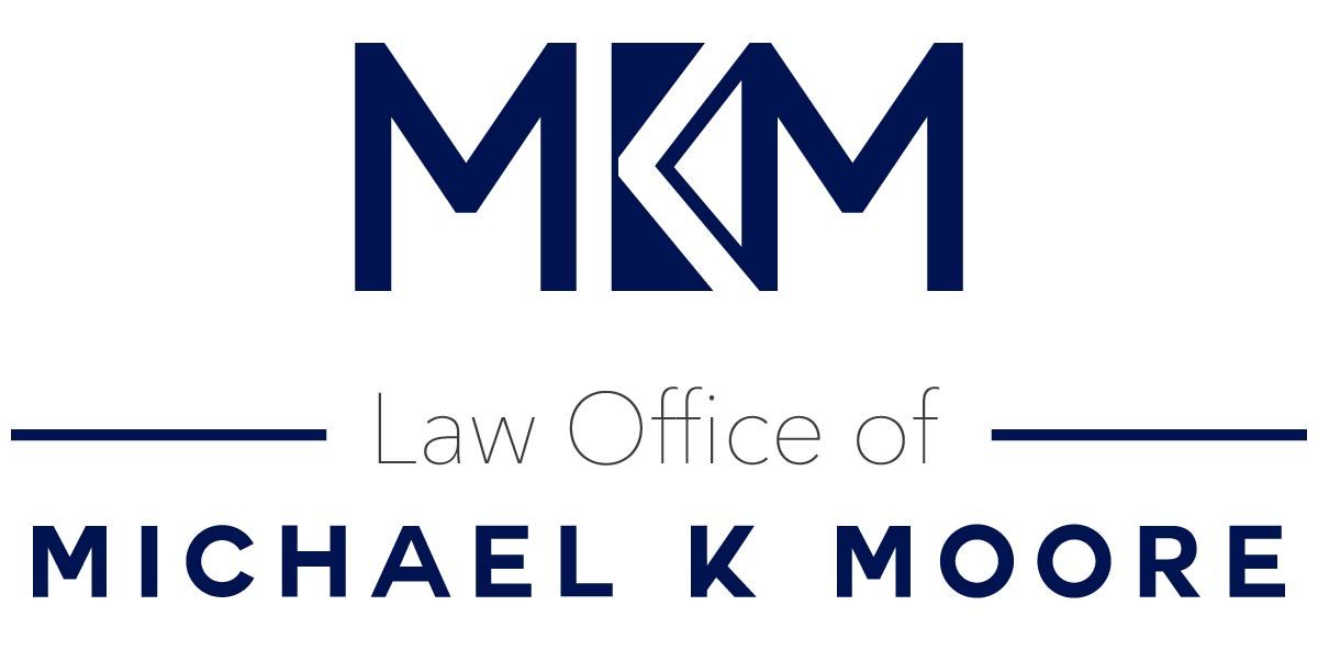Logo for Michael K. Moore Law Office with navy blue 