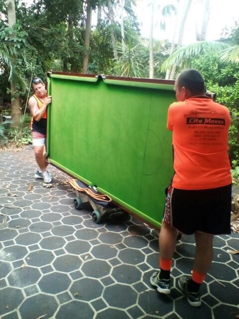 Movers Unloading Sofa From Truck On Street — Lite Moves Furniture Removals In Bonville, NSW