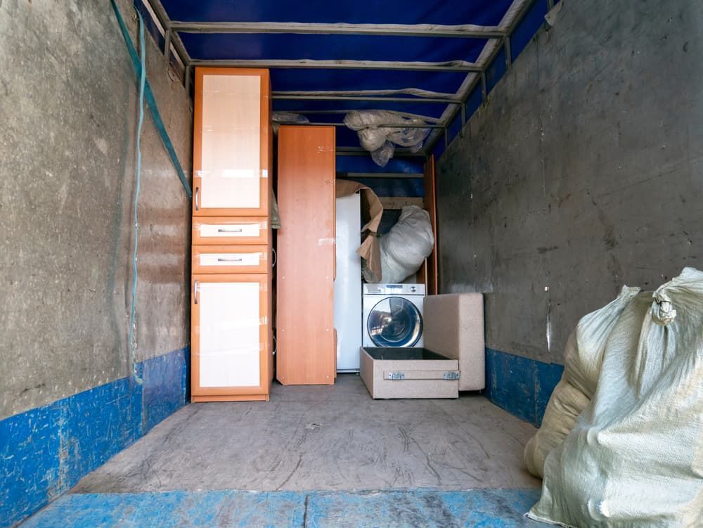 The Inside of A Moving Truck Filled with Furniture and Appliances — Lite Moves Furniture Removals In Sunshine Coast, QLD