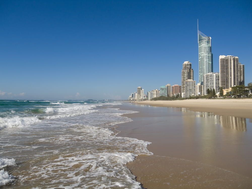 A Beach with A City Skyline in The Background — Lite Moves Furniture Removals In Bonville, NSW