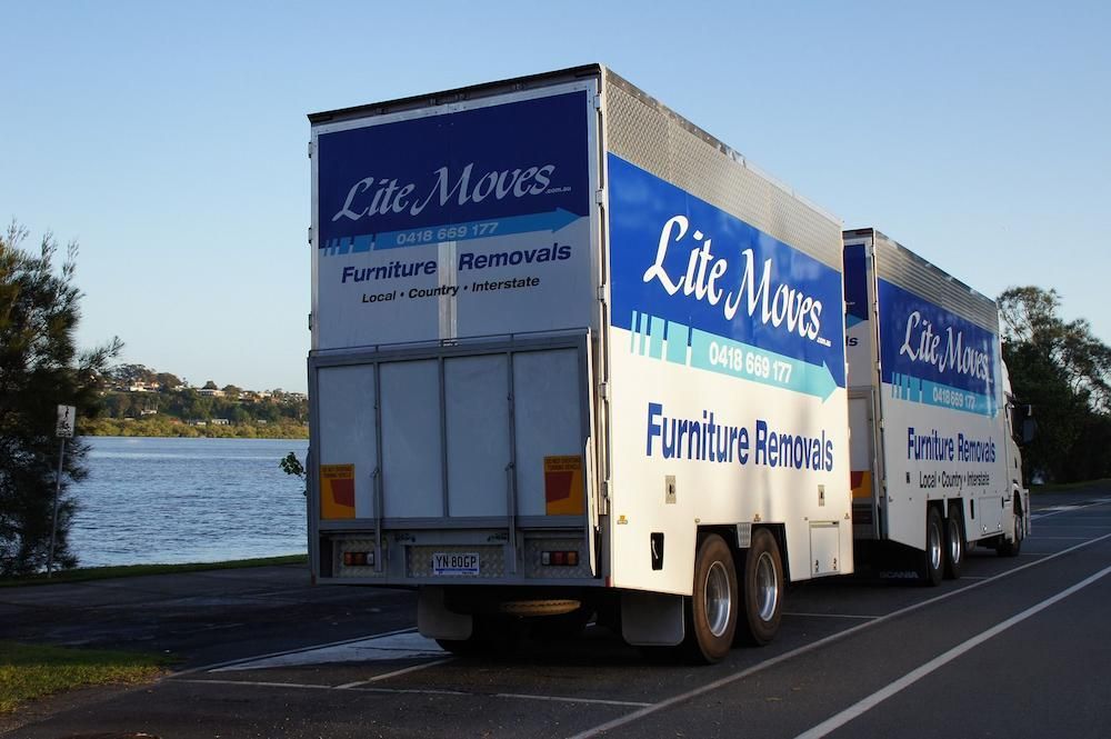 Two White Lite Moves Furniture Removal Trucks — Lite Moves Furniture Removals In Sydney, NSW