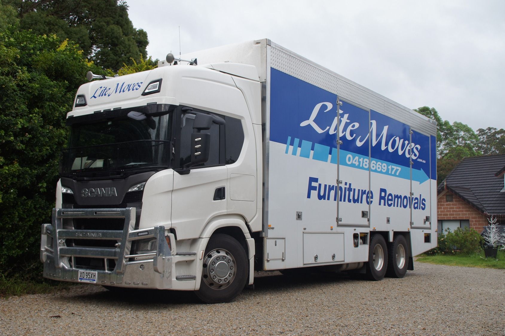 Crew doing a packaging service — Lite Moves Furniture Removals In Bonville, NSW